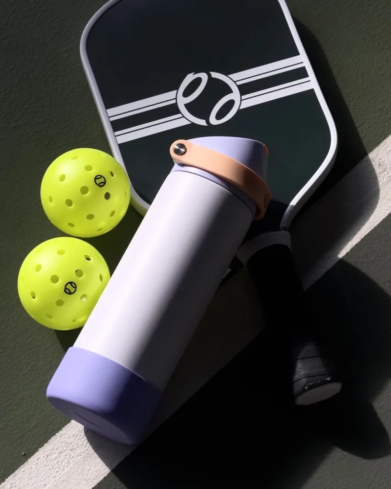 Hydrate and play — pickleball kit on court